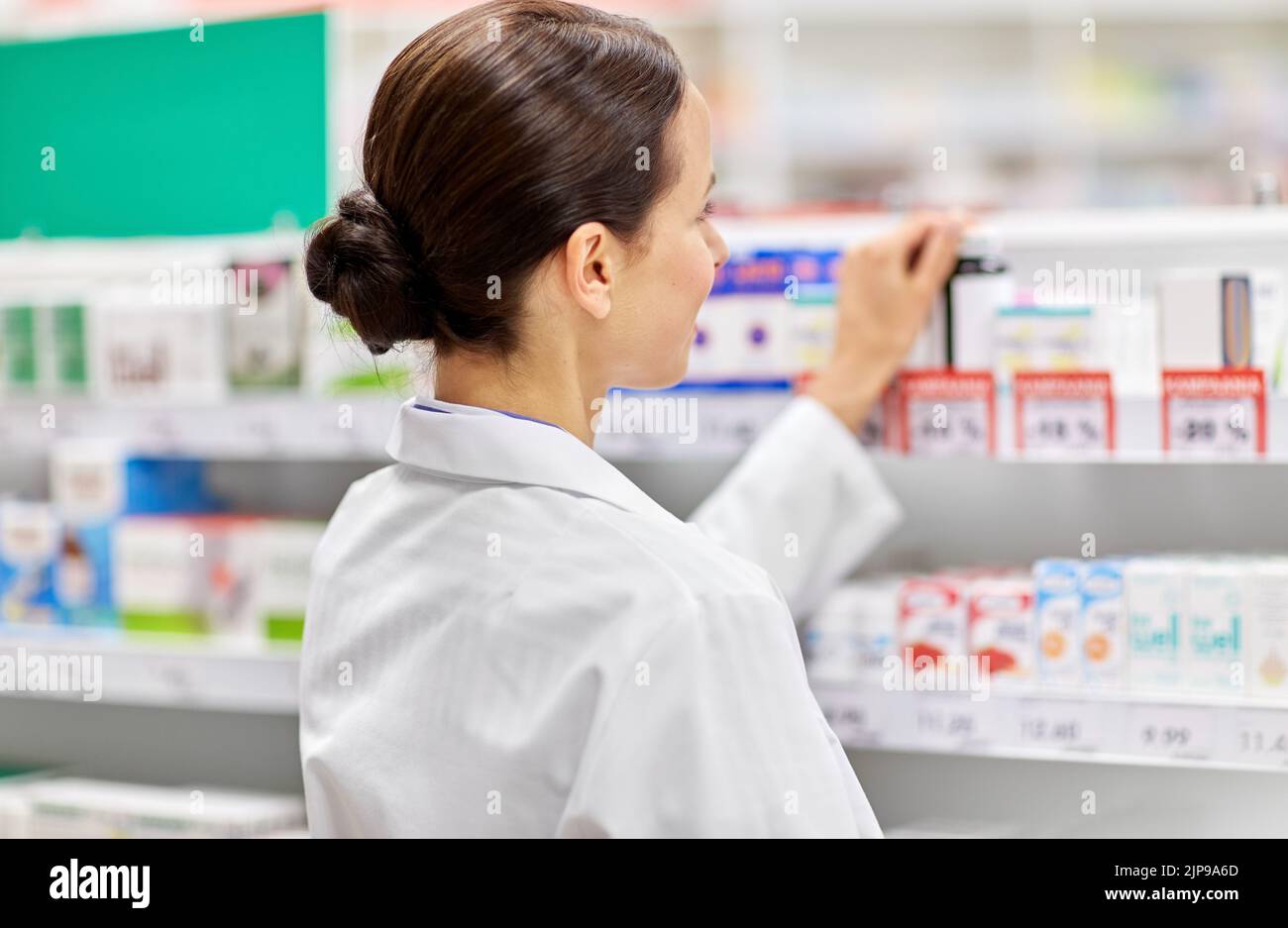 Woman pharmacist rear view hi-res stock photography and images - Alamy
