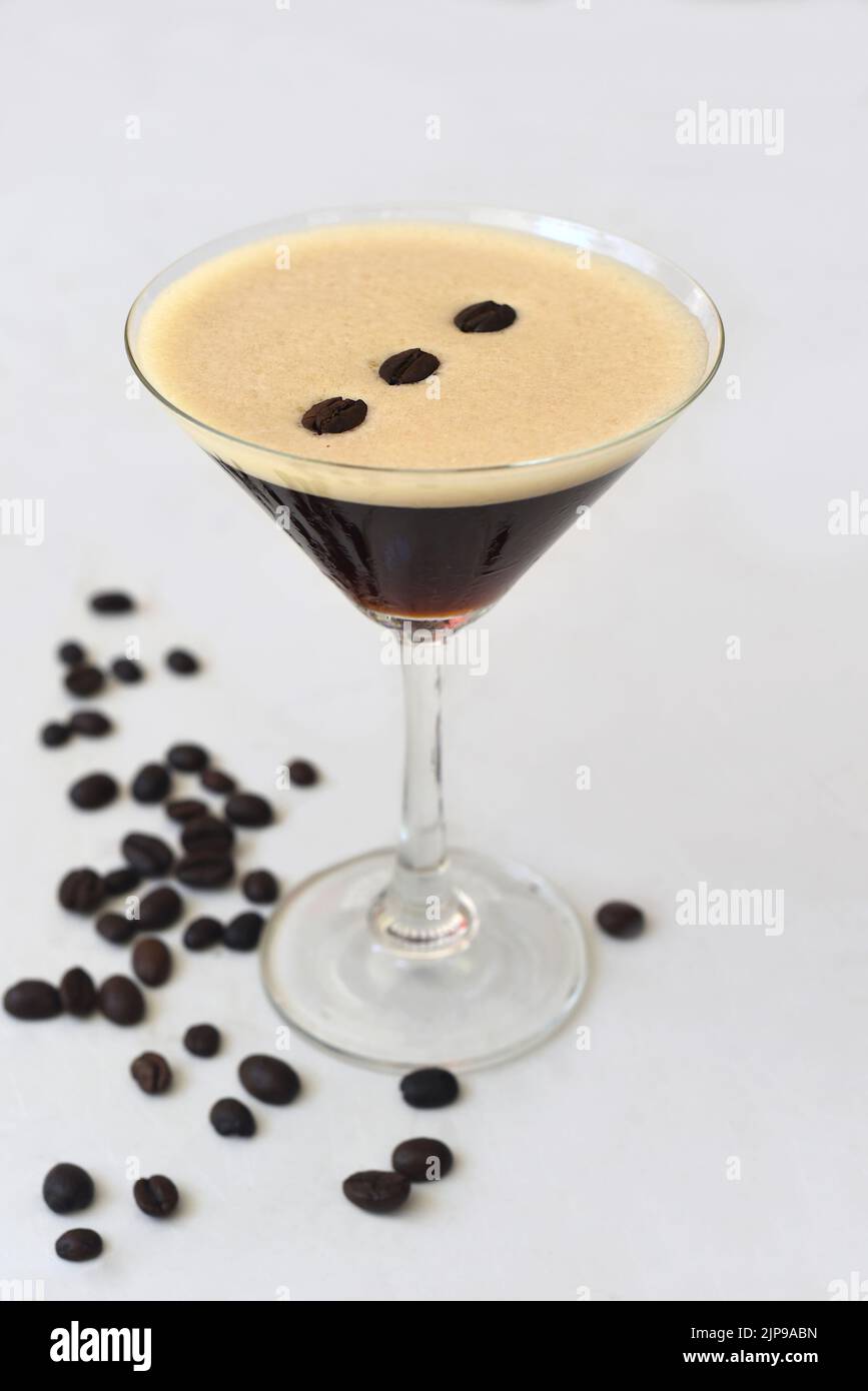 Expresso martini with coffee beans on white background Stock Photo Alamy