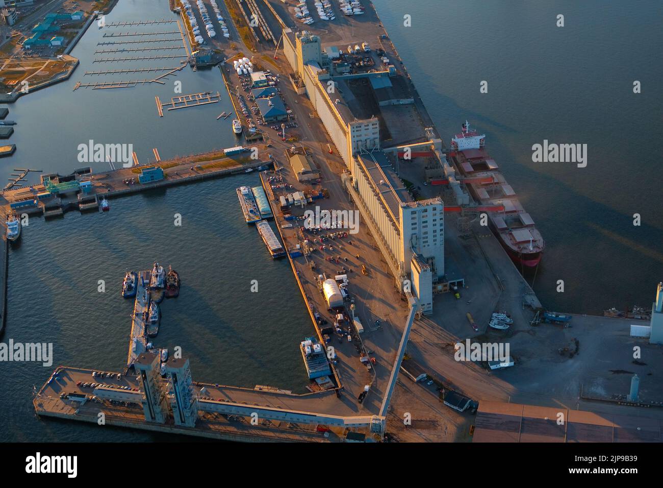 A ship is supplied with grain from the Bunge grain silo in Quebec city in this aerial photo November 11, 2009. Stock Photo