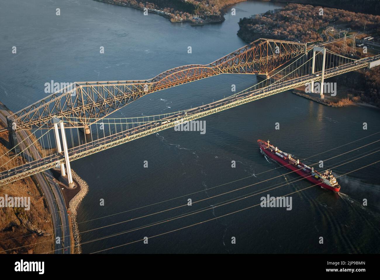 A ship passes under the Pont Pierre Laporte bridge and the Pont de Quebec bridge in Quebec city in this aerial photo November 11, 2009. Stock Photo