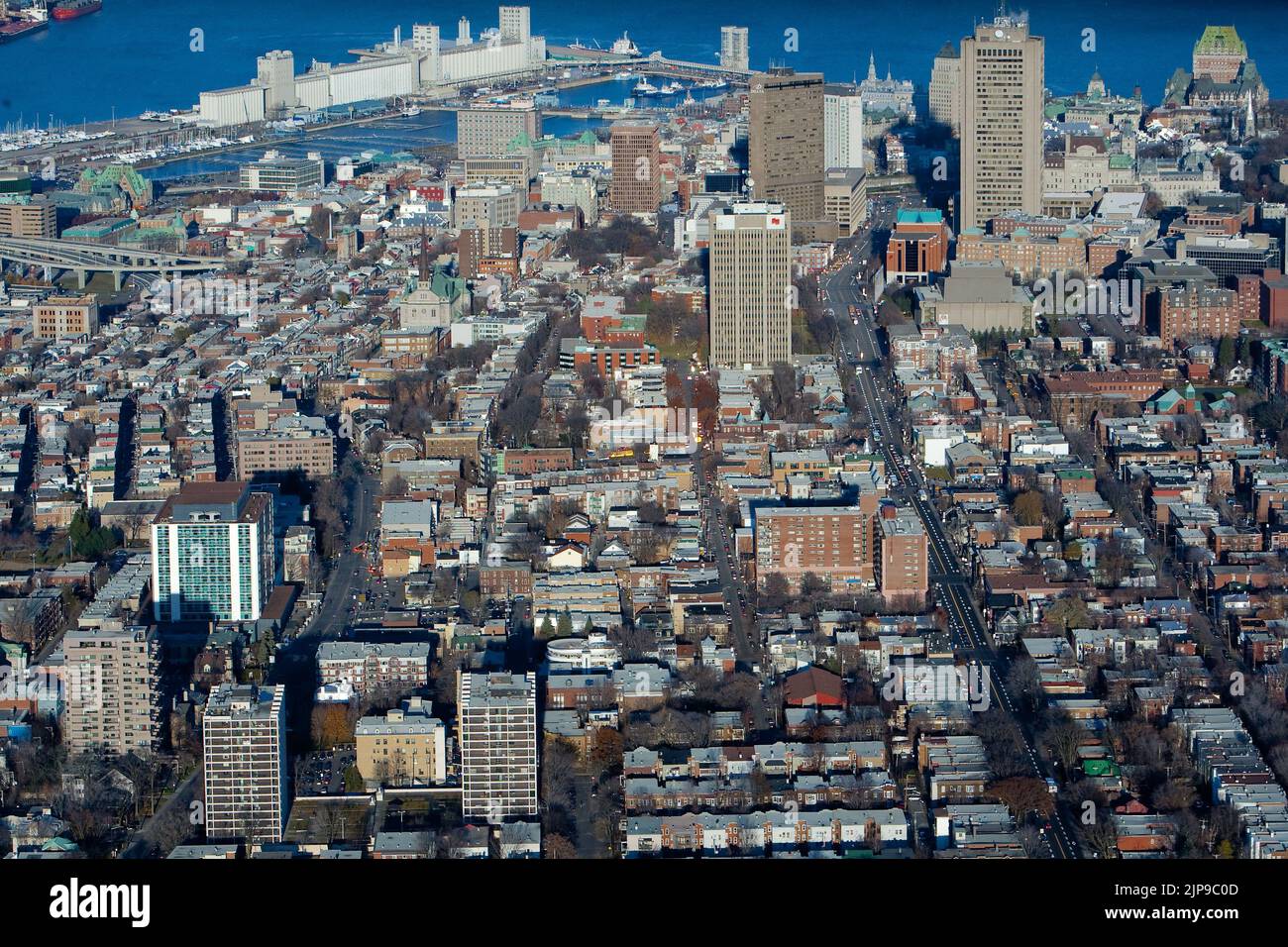 Quebec city's skyline is pictured from West to East in this aerial photo November 11, 2009. In this picture can be seen St-Jean-Baptiste district, Montcalm district Complexe G (edifice Marie-Guyard), Hotel Delta, Hotel Hilton, Chateau Frontenac, Bunge grain Silo and the St-Lawrence river. Stock Photo