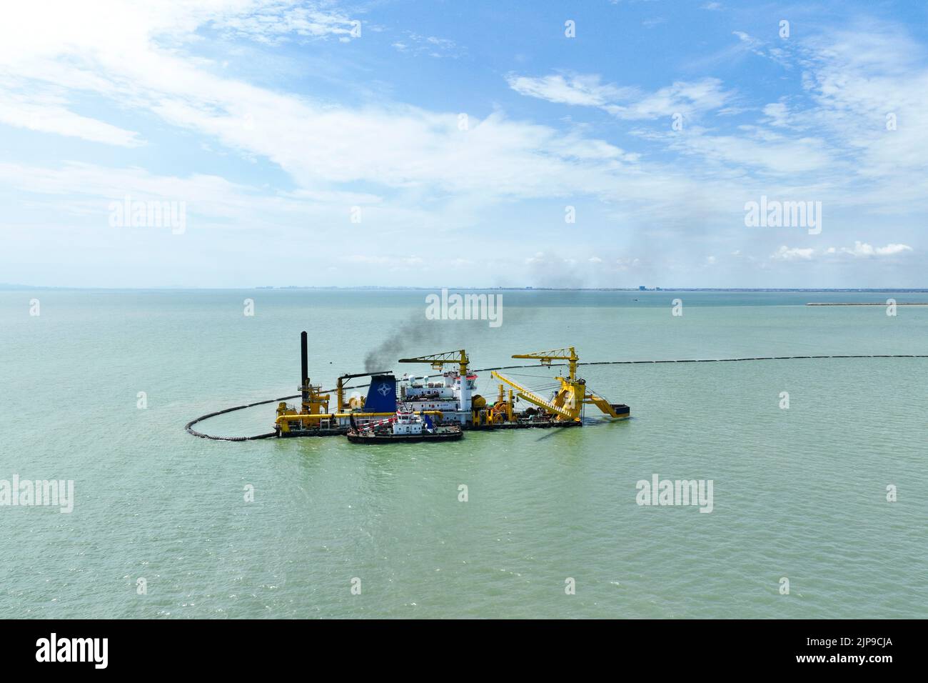 LIANYUNGANG, CHINA - AUGUST 16, 2022 - A large cutter suction dredger carries out dredging and filling construction work at Ganyu Port area of Lianyun Stock Photo