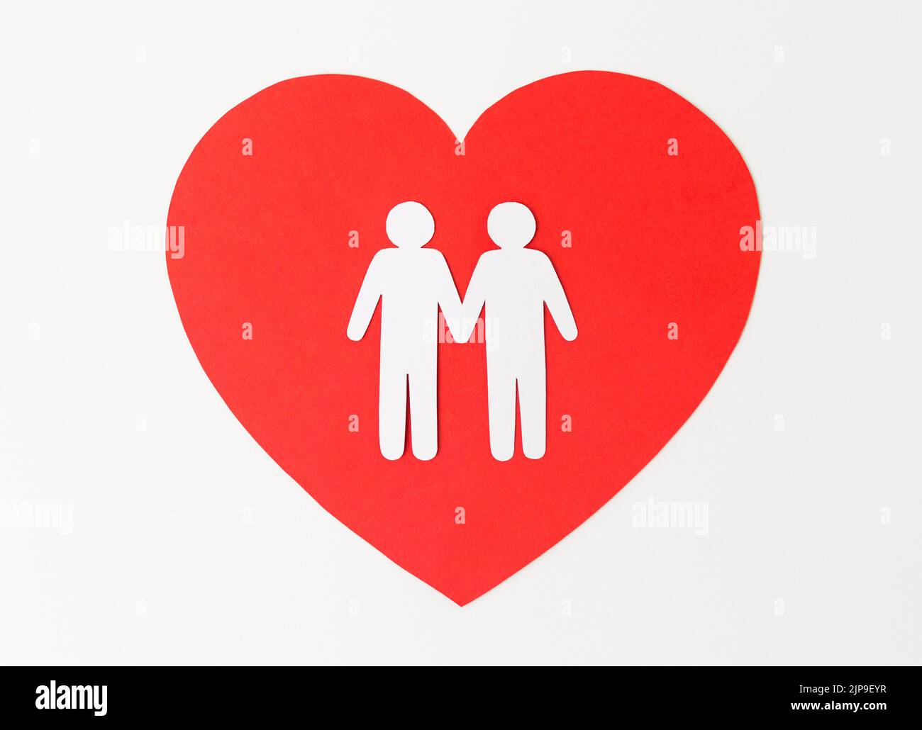 paper cutout of male gay couple on red heart Stock Photo