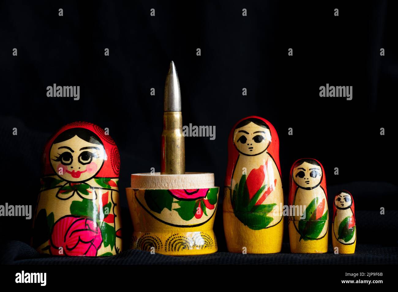 Russian nesting doll with a bullet inside, Russian aggressive culture, war in Ukraine with Russians 2022 Stock Photo