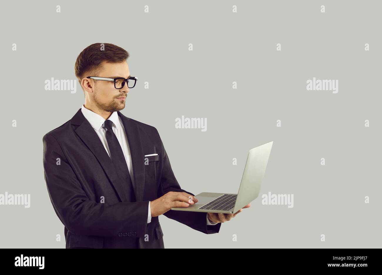 Serious businessman work on laptop Stock Photo