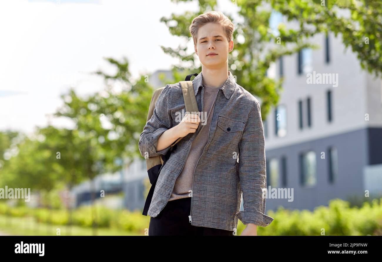 teenage student boy with backpack in city Stock Photo