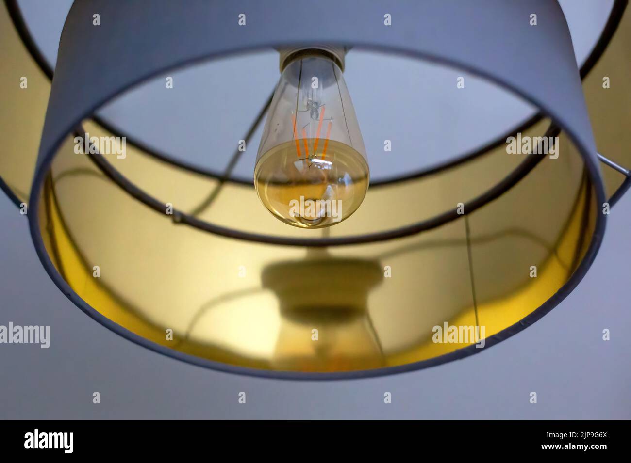 close-up of modern lampshade with lightbulb Stock Photo