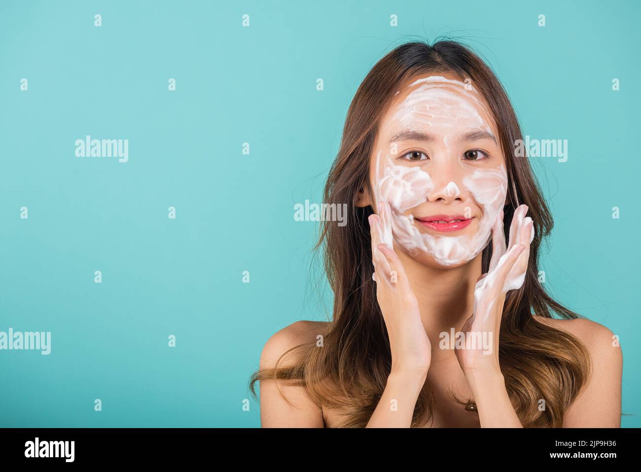Asian woman face wash exfoliate scrub soap foam with skincare cleansing