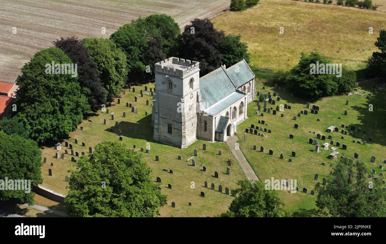 An aerial view of Saint Hilda's Church and graveyard at Sherburn