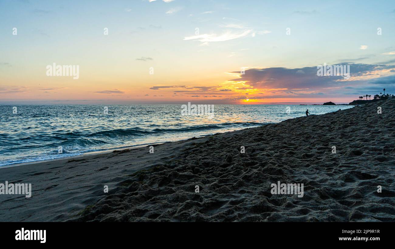 Beautiful sunset on the beaches of Laguna Beach in Orange County in California. Sunset with the beach and a fabulous sea. Stock Photo