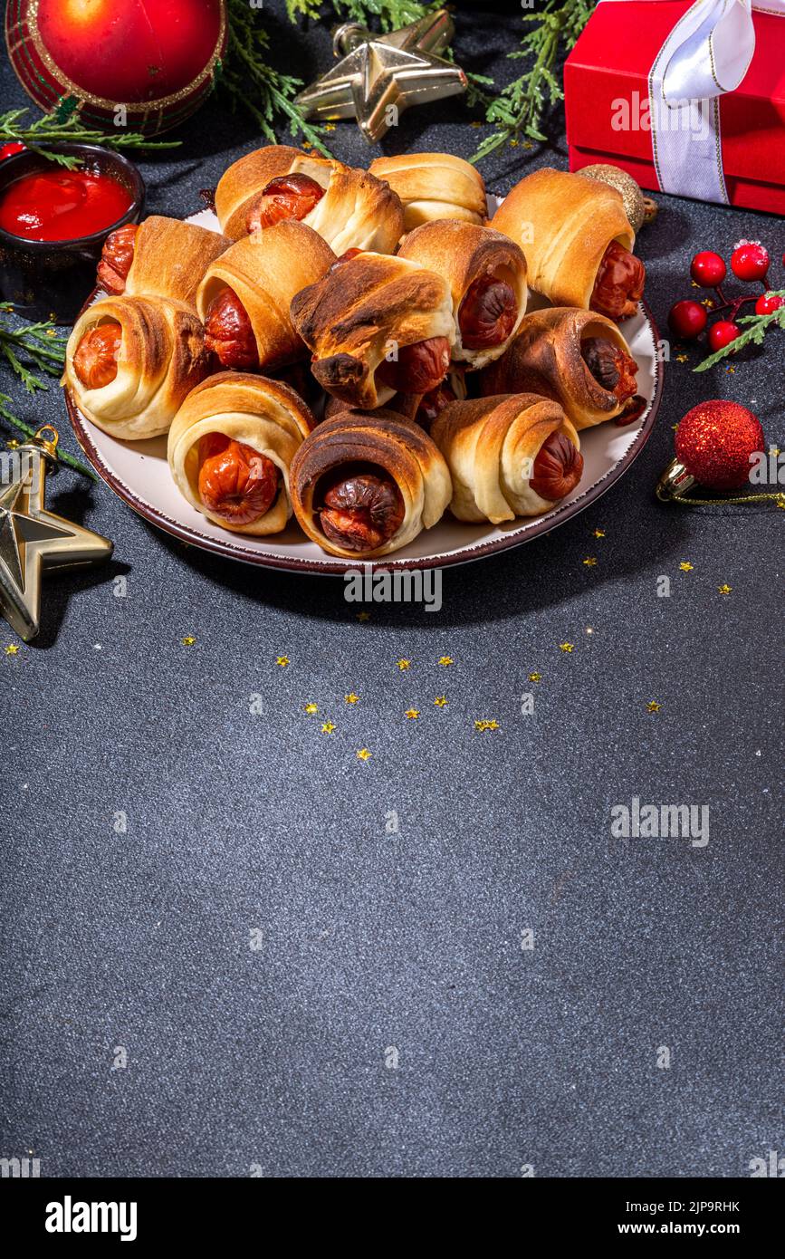 Traditional Christmas dish recipe Pigs in blankets, sausages wrapped in