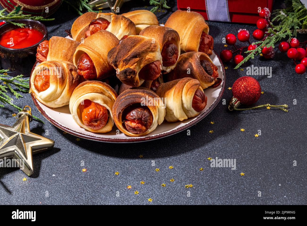 Traditional Christmas dish recipe Pigs in blankets, sausages wrapped in