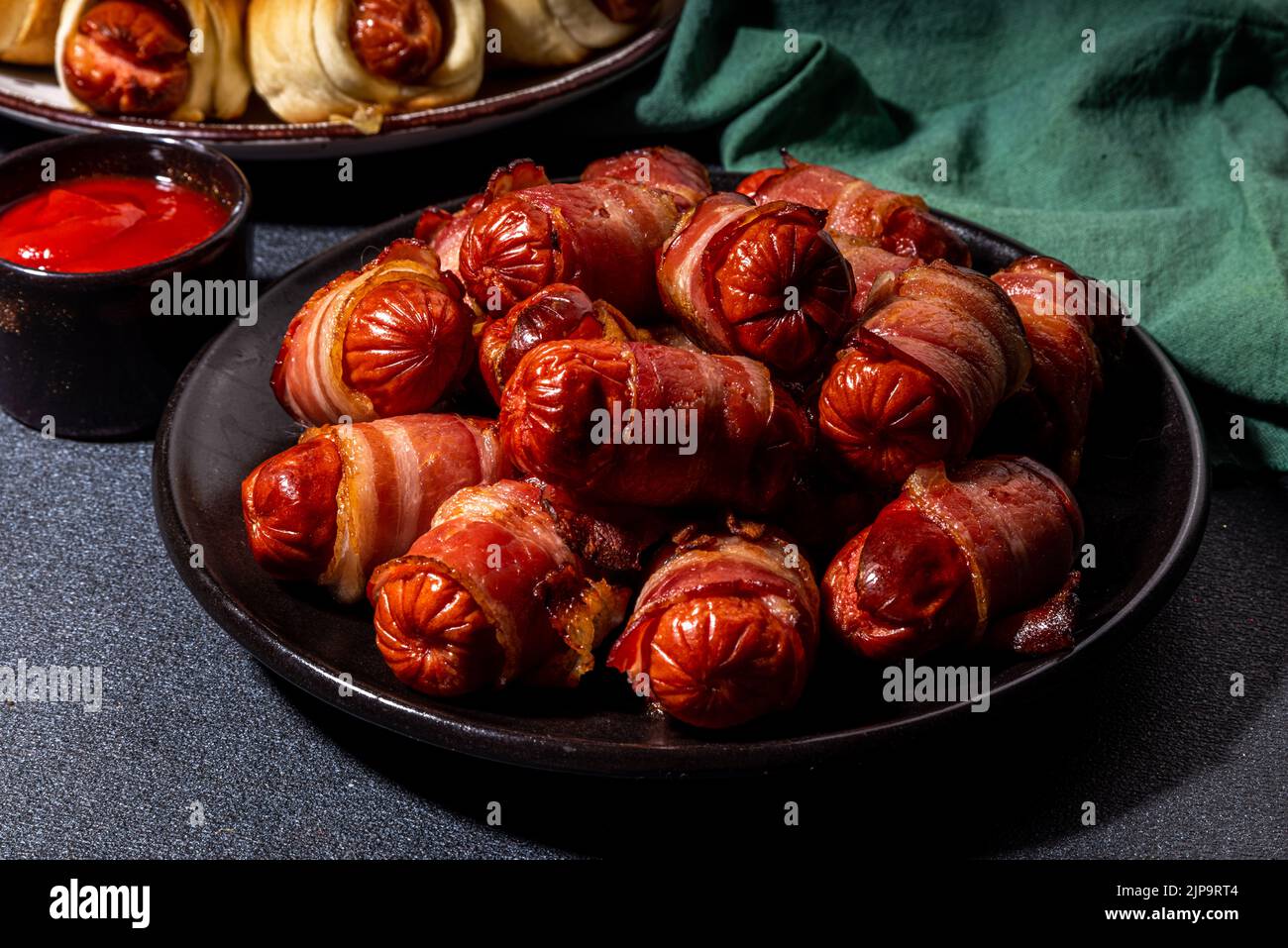 Traditional Christmas dish recipe Pigs in blankets, sausages wrapped in