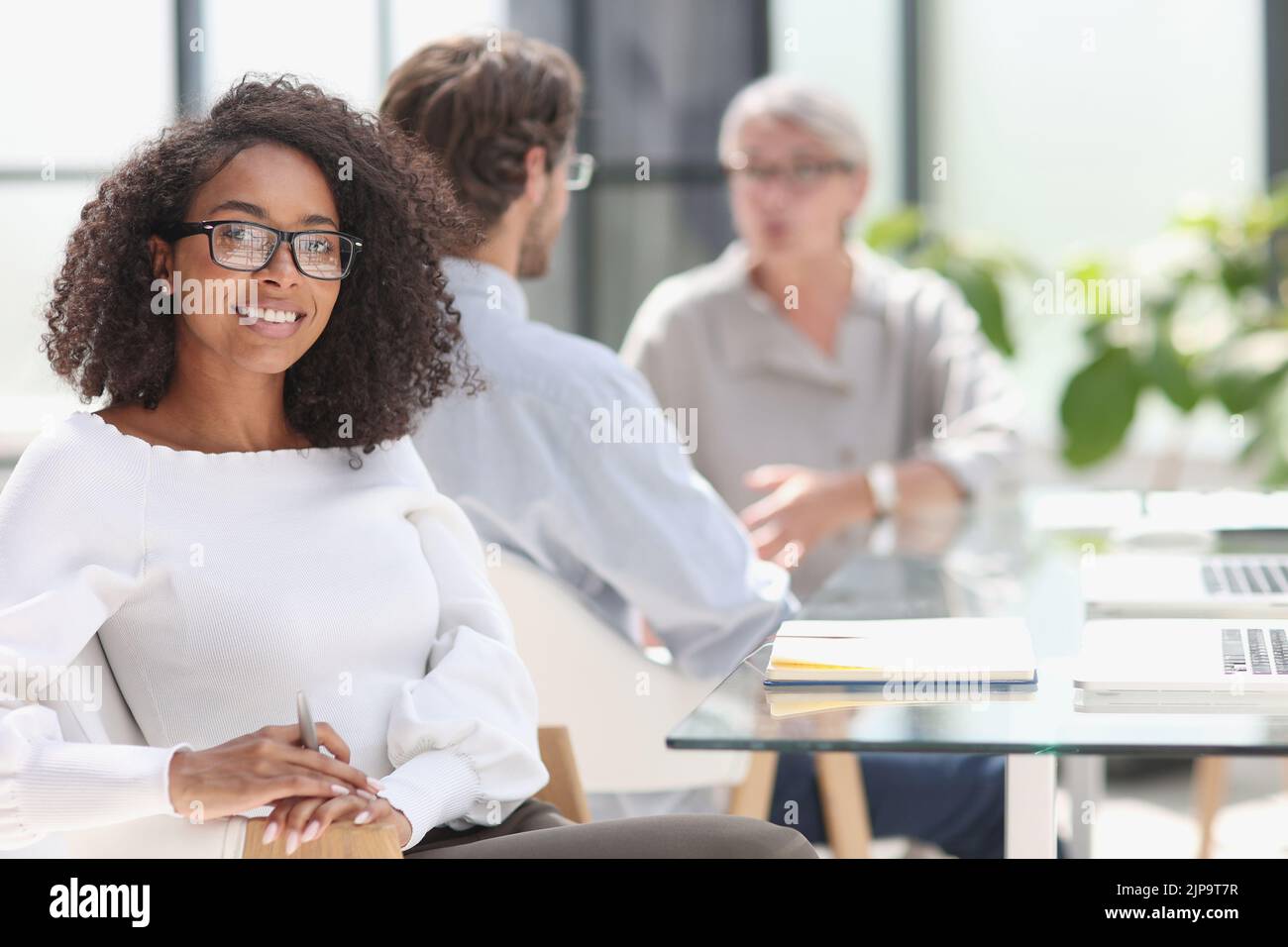 young attractive african american woman in the office Stock Photo - Alamy