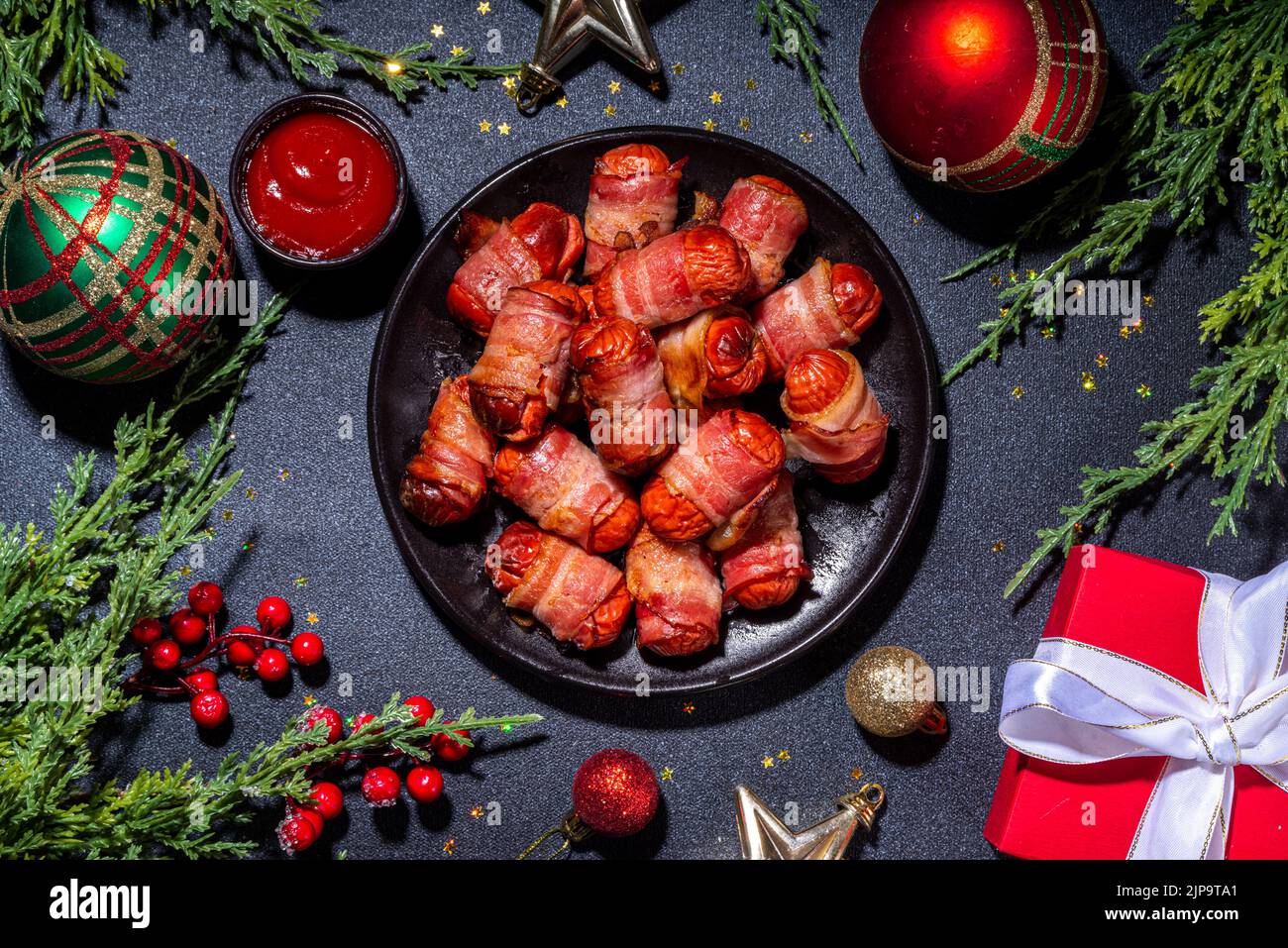 Traditional Christmas dish recipe Pigs in blankets, sausages wrapped in