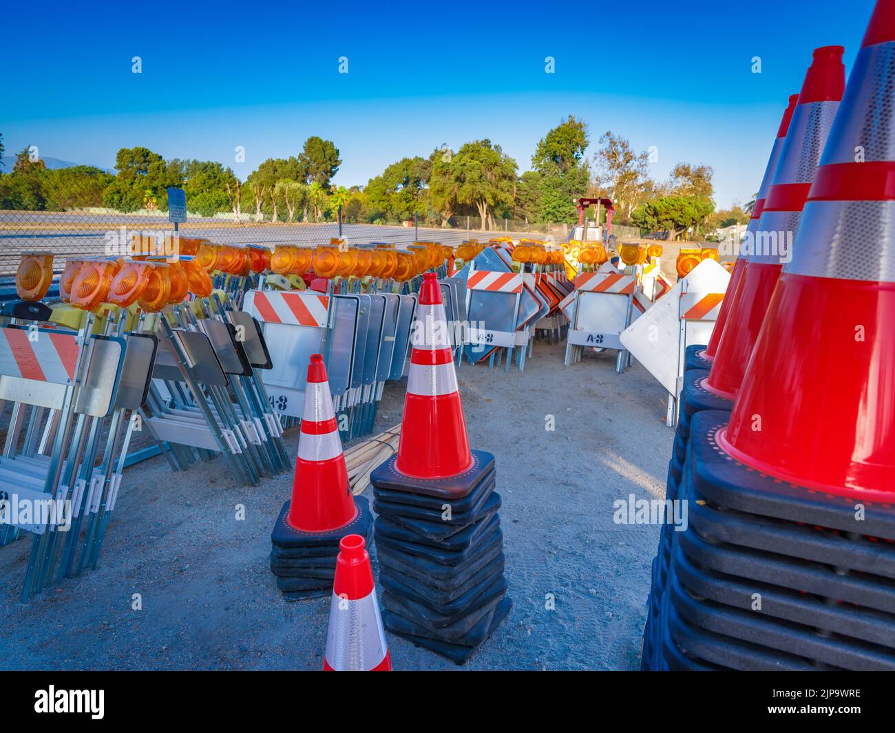Traffic safety cones, signs and flashers at road construction site