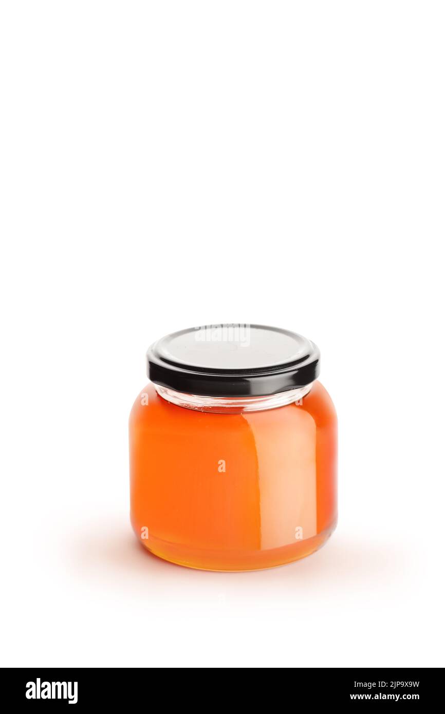 Studio shot of a small honey jar isolated on white background Stock Photo