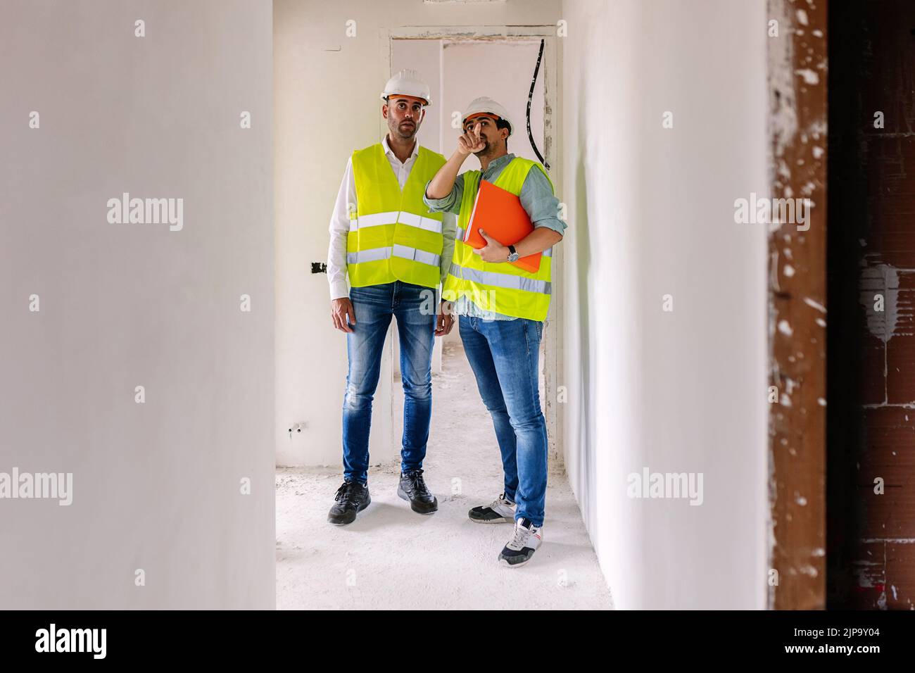 Professional engineer architect workers in conversation at construction site Stock Photo