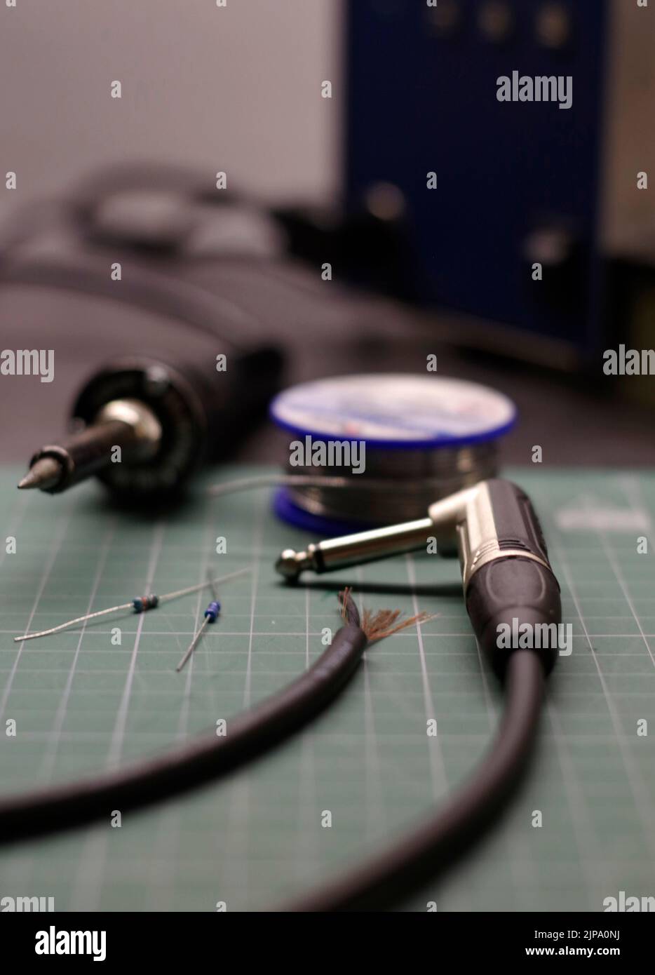Soldering guitar cable Stock Photo Alamy