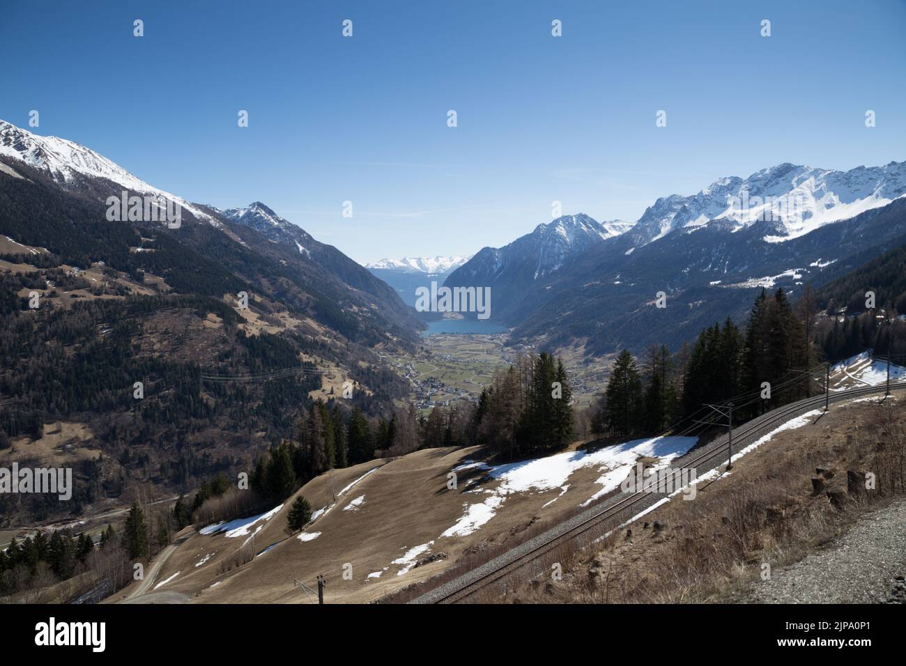 View to Poschiavo valley seen from the UNSECO World Heritage Bernina Express train route St. Moritz to Poschiavo, Grison, Switzerland Stock Photo