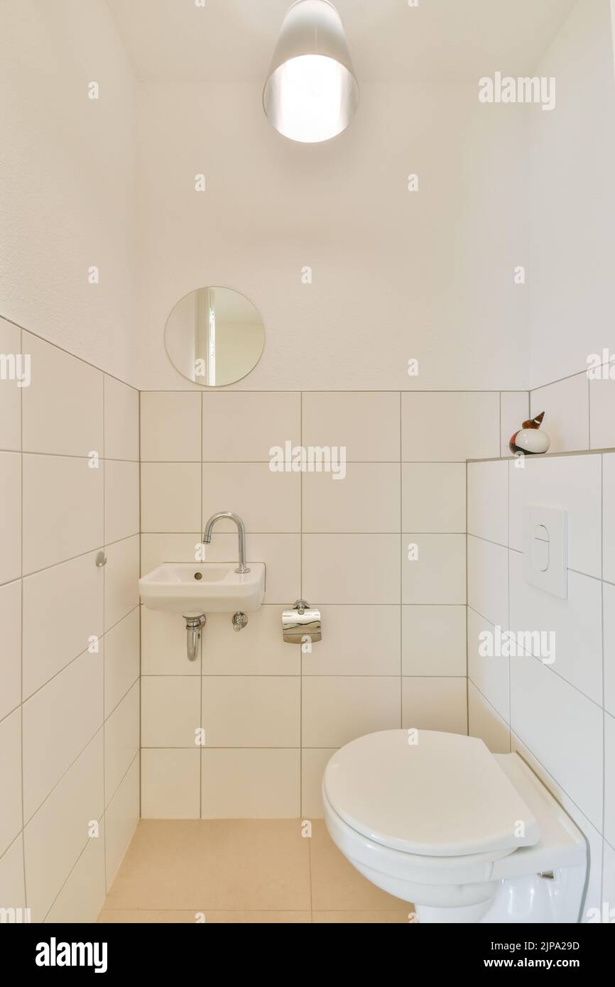 Modern home interior design of white bathroom with open bathtub and