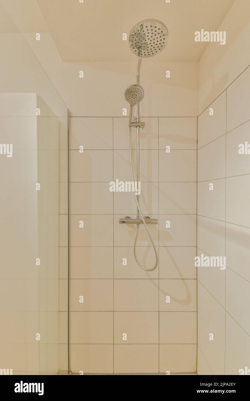 Modern home interior design of white bathroom with open bathtub and