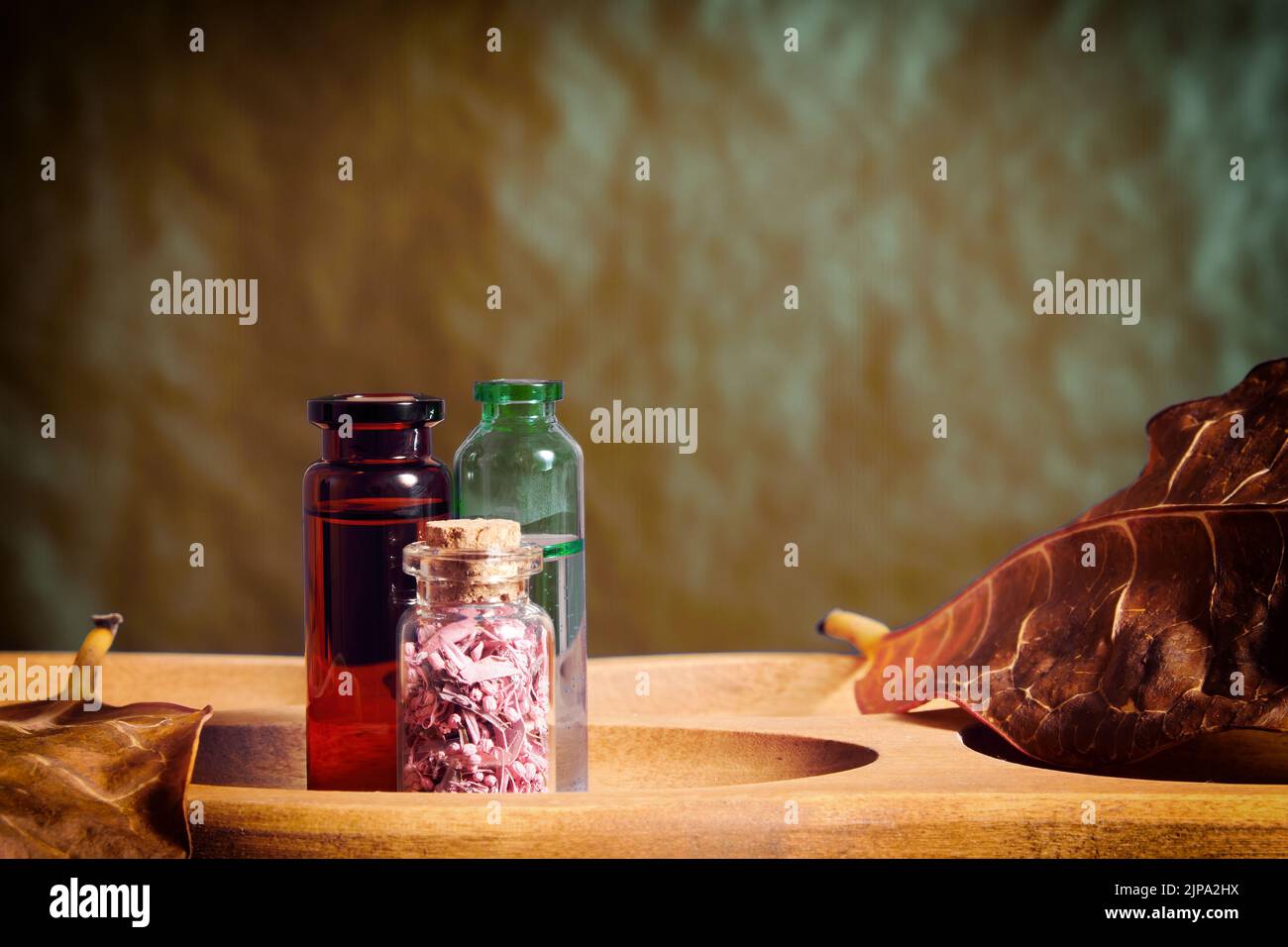 Set of vials and jars with essential oils and tonics for skin care