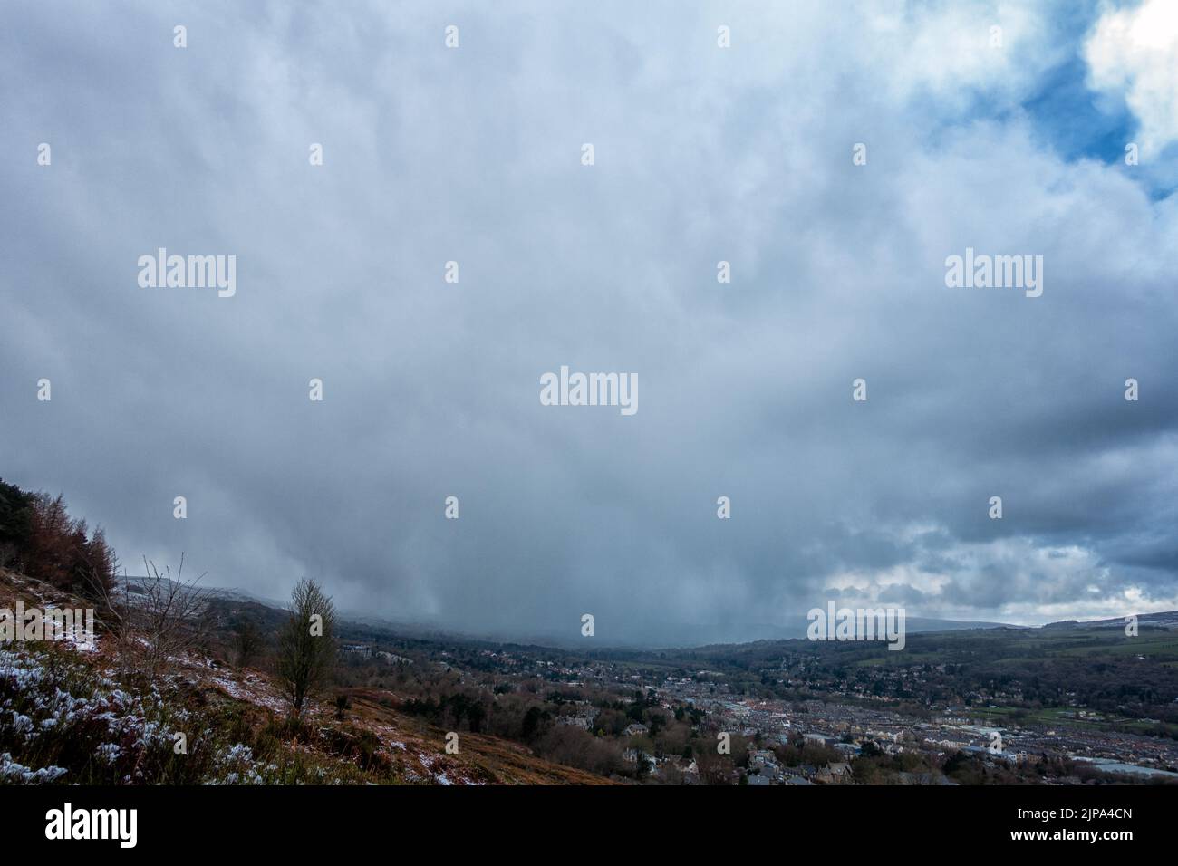 Epic looking snow cloud travelling through Wharfedale and heading for Ilkley, West Yorkshire, England, UK Stock Photo