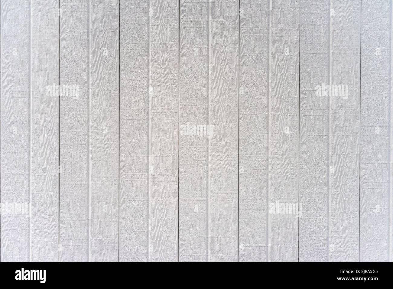 White aluminum patio cover finishing in a embossed faux wood grain texture Stock Photo