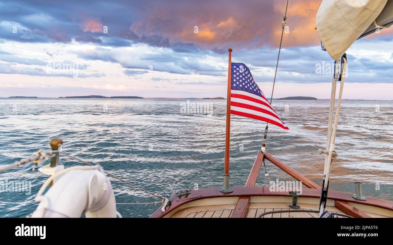 American flag on the stern of a sail boat Stock Photo