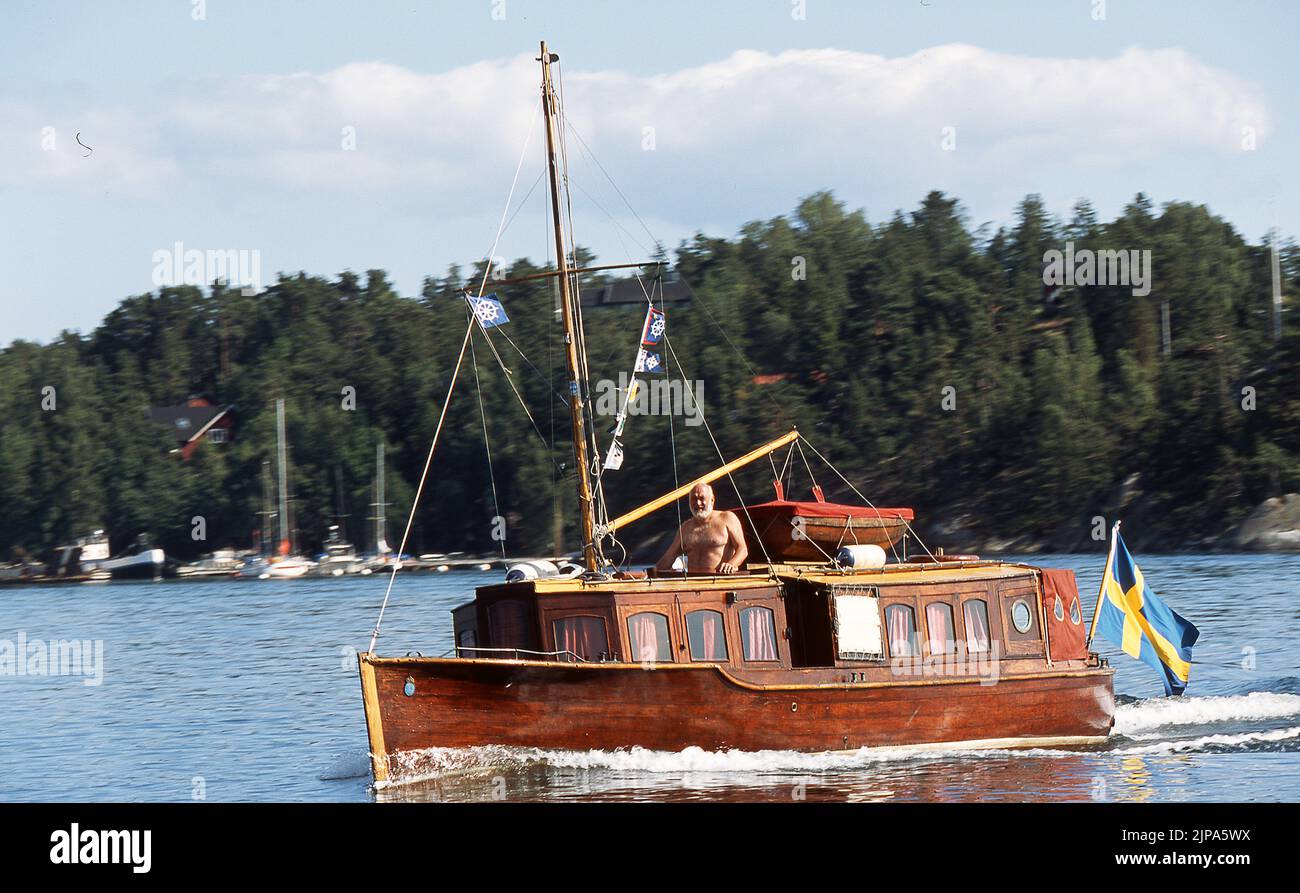 Old mahogany boat at see in baltic see outside Stockholm sweden Stock Photo