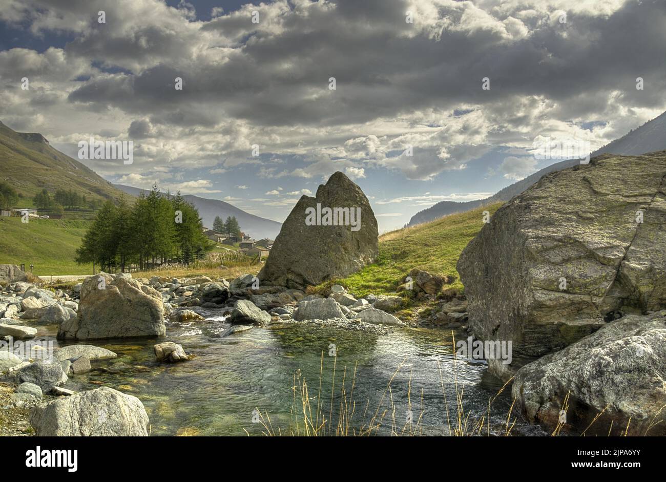 A scenic view of a river stream through the rocky path under the big ...