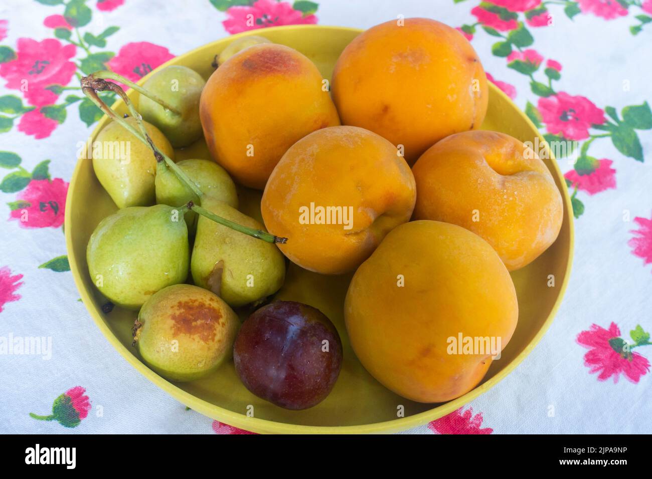 A bowl with peachs and pears Stock Photo