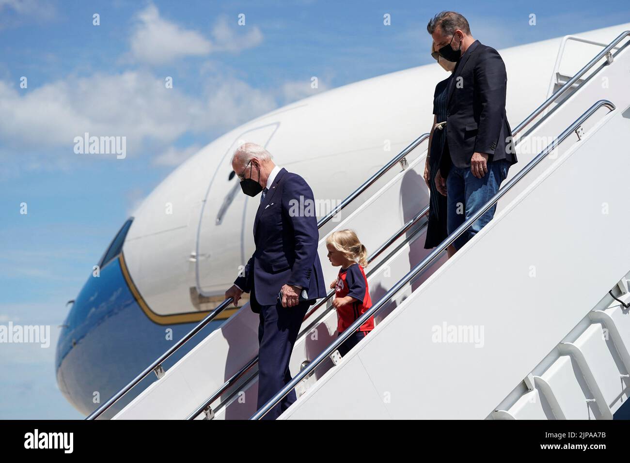 U.S. President Joe Biden walks from Air Force One with his grandson Beau Biden, son Hunter and daughter-in-law Melissa Cohen as he returns from Kiawah Island, South Carolina, at Joint Base Andrews in Maryland, U.S., August 16, 2022.      REUTERS/Joshua Roberts Stock Photo