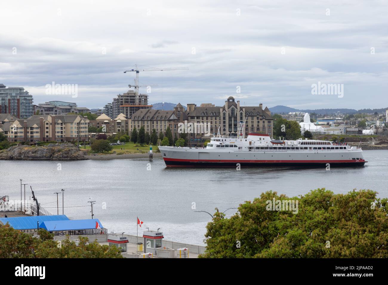 Ferry in Downtown Victoria Harbour during cloudy day Stock Photo - Alamy