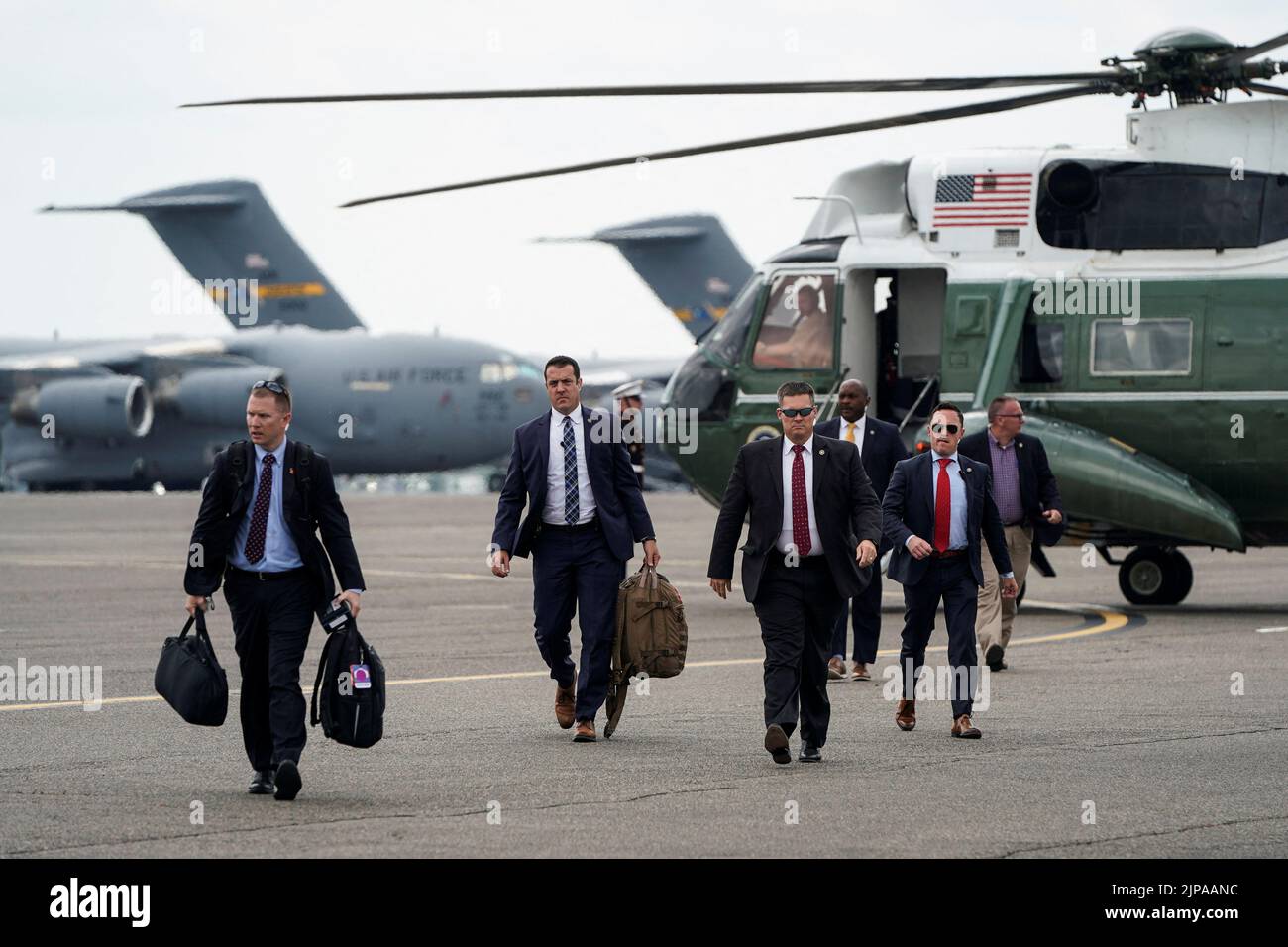 Secret Service agents arrive ahead of U.S. President Joe Biden before his departure for Washington, D.C., from Joint Base Charleston, South Carolina, U.S., August 16, 2022.      REUTERS/Joshua Roberts Stock Photo
