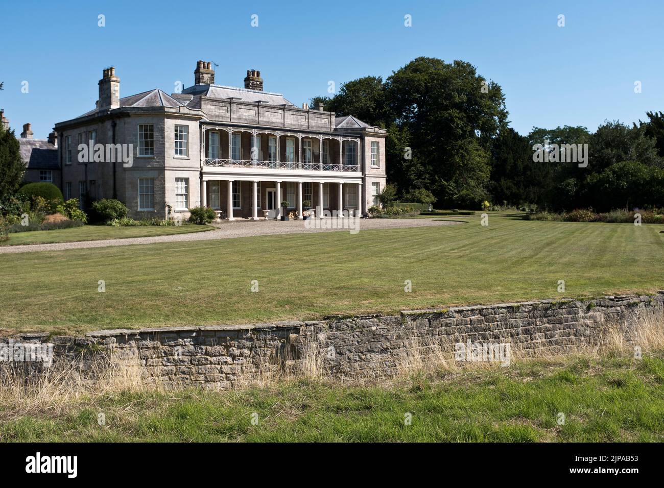 dh Country house NEWTON KYME YORKSHIRE English lawns Ha ha sunken wall vertical walls a garden lawn exterior uk manor mansion Stock Photo