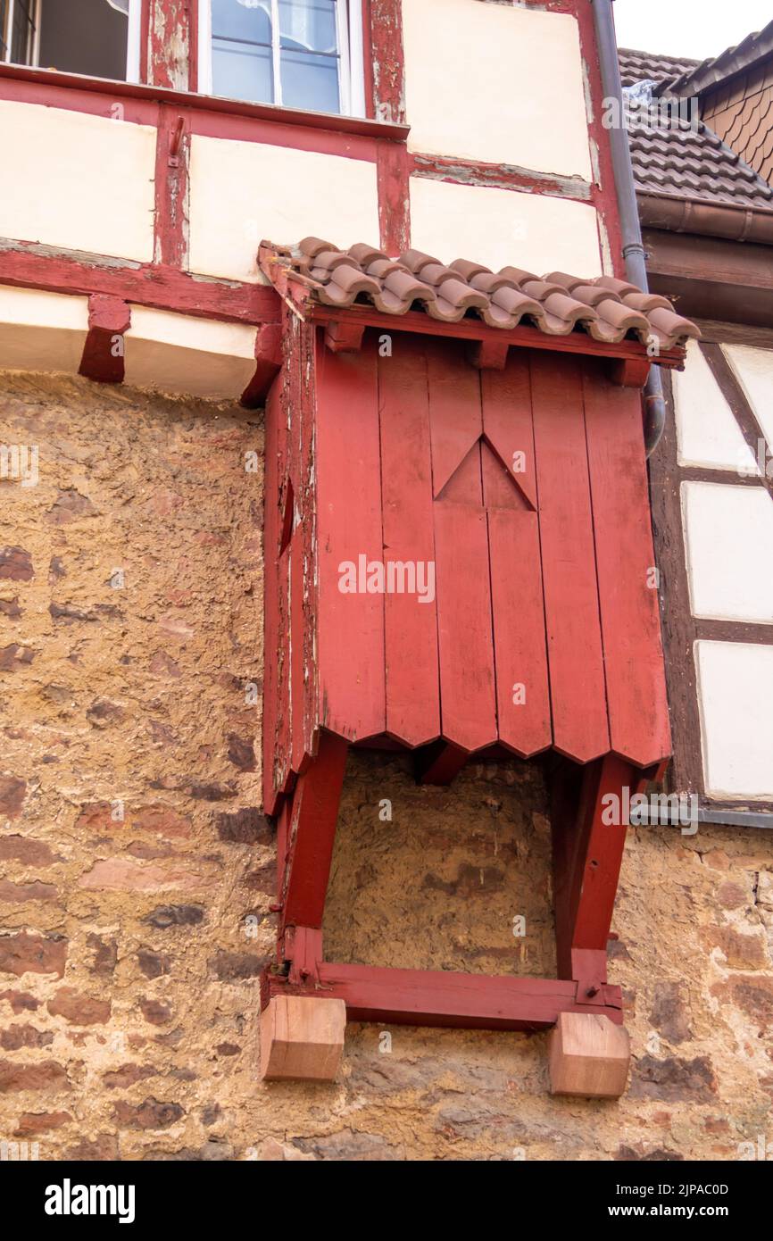 Medieval Exterior wooden toilet or garderobe at a half-timbered house in southern germany village. Stock Photo