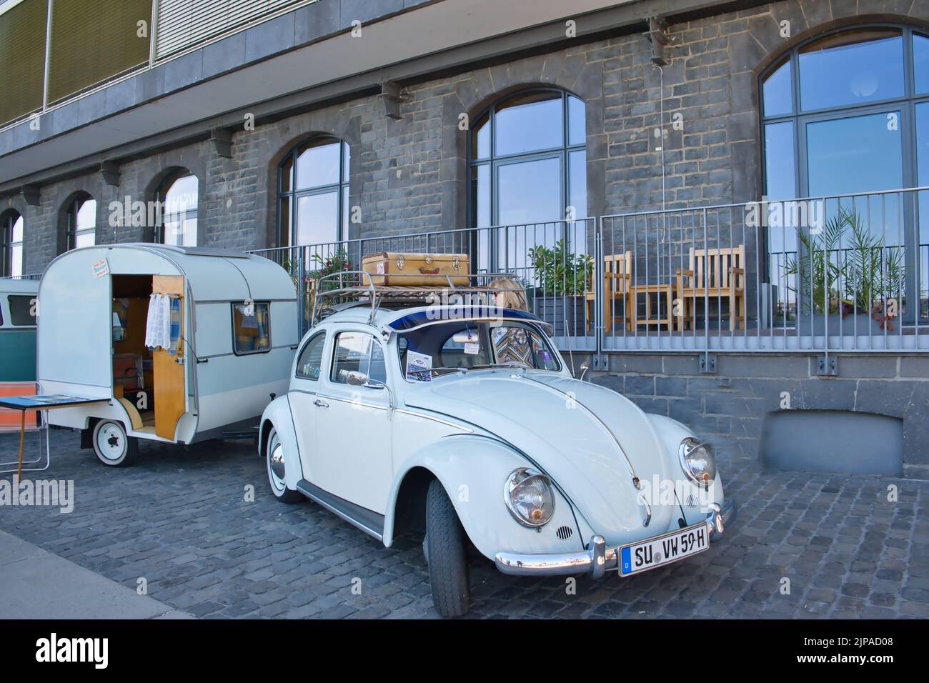 Volkswagen, VW Beetle with caravan from the sixties at the vintage car exhibition in Cologne, Germany, Stock Photo