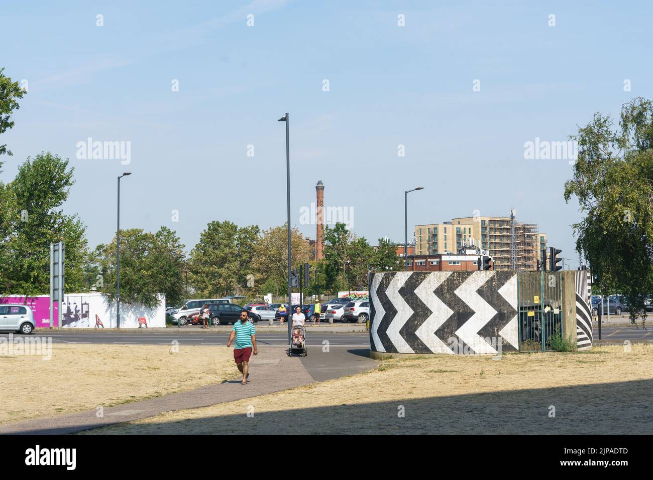 The iconic Horlicks Factory chimney can be seen from Slough town centre. Slough, Berkshire, UK. Urban redevelopment. Stock Photo