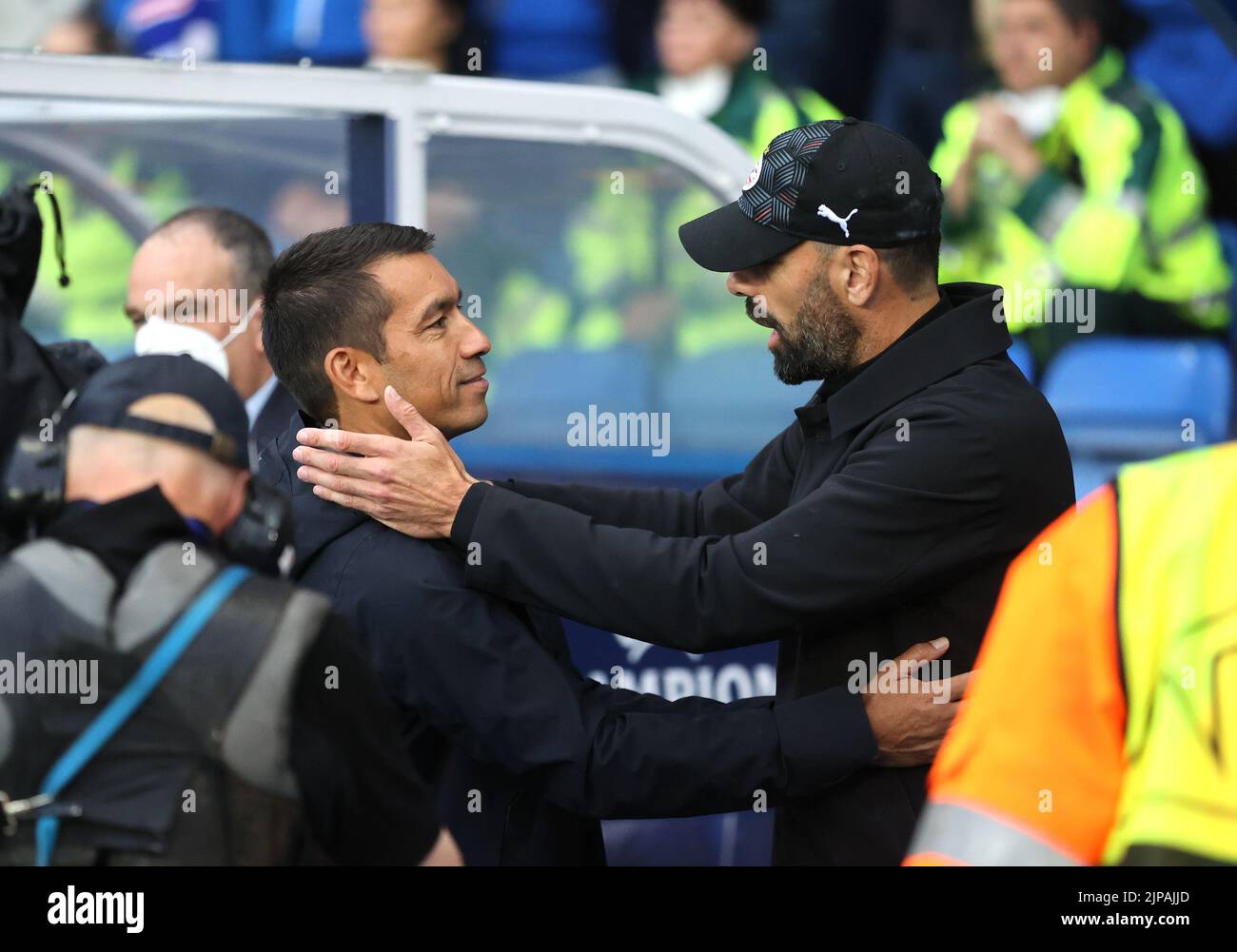 Rangers manager Giovanni van Bronckhorst greets PSV Eindhoven manager Ruud van Nistelrooy during the Champions League qualifying match at Ibrox, Glasgow. Picture date: Tuesday August 16, 2022. Stock Photo