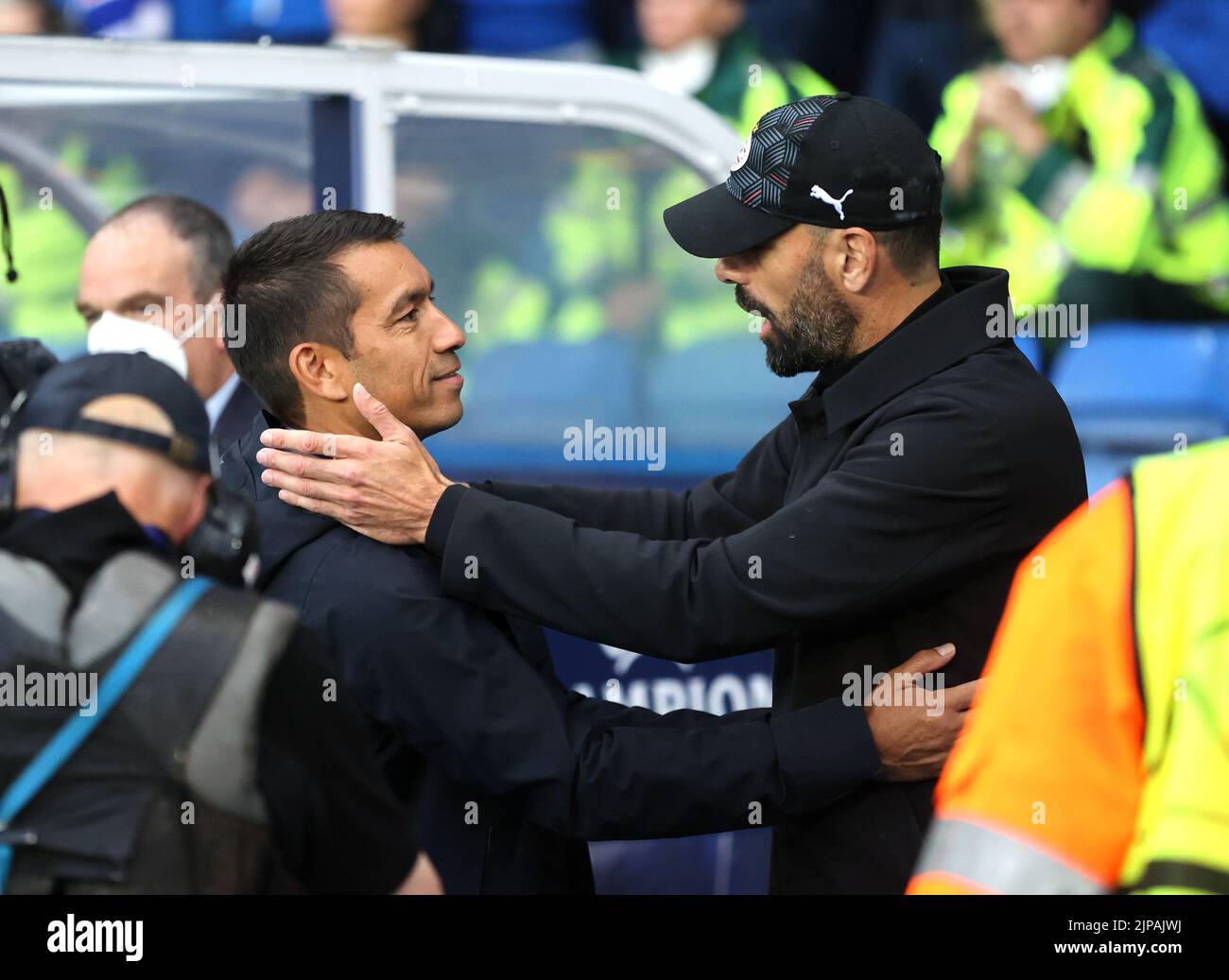 Rangers manager Giovanni van Bronckhorst greets PSV Eindhoven manager Ruud van Nistelrooy during the Champions League qualifying match at Ibrox, Glasgow. Picture date: Tuesday August 16, 2022. Stock Photo