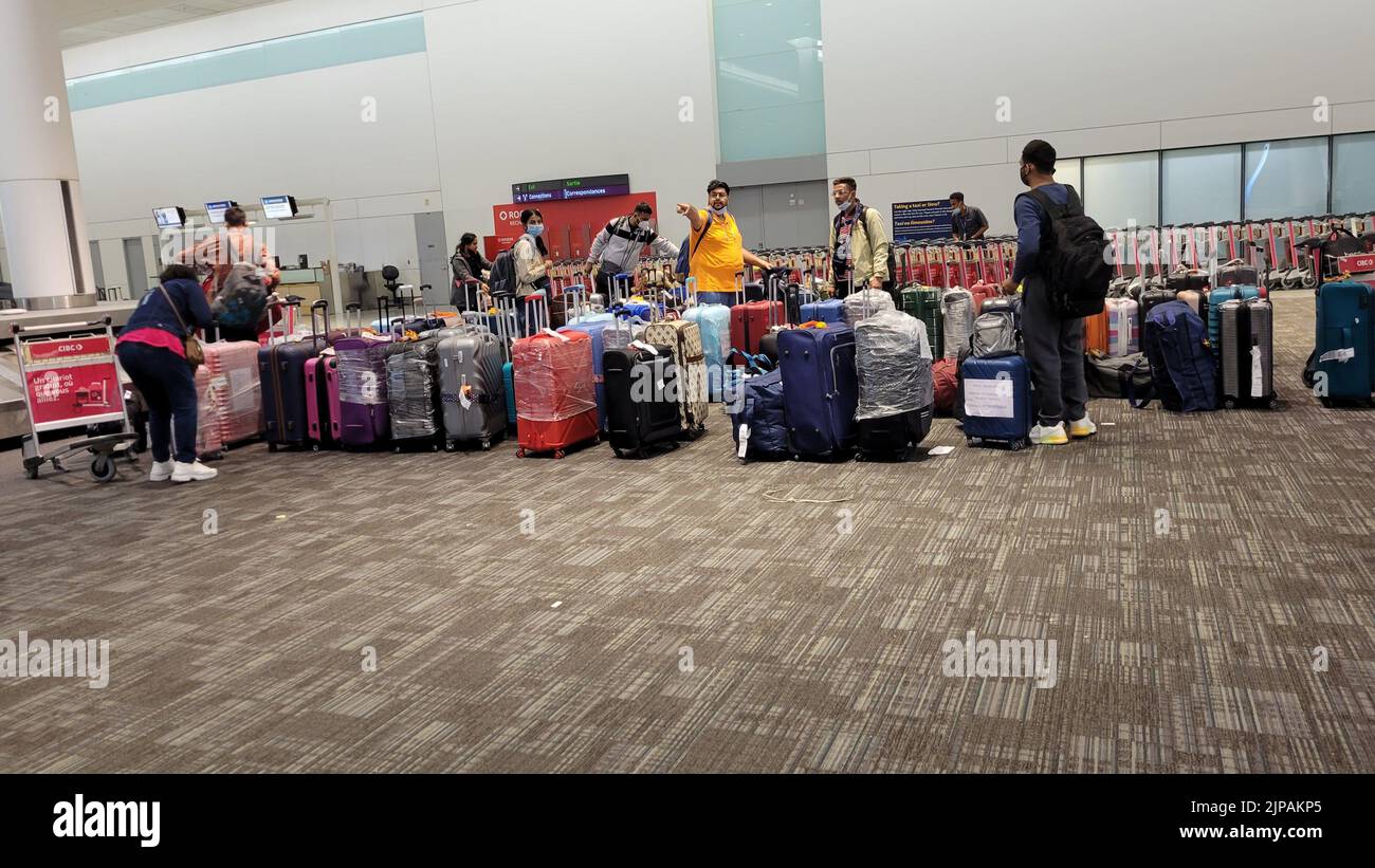 Airline passengers searching for their lost luggage at Airport Terminal