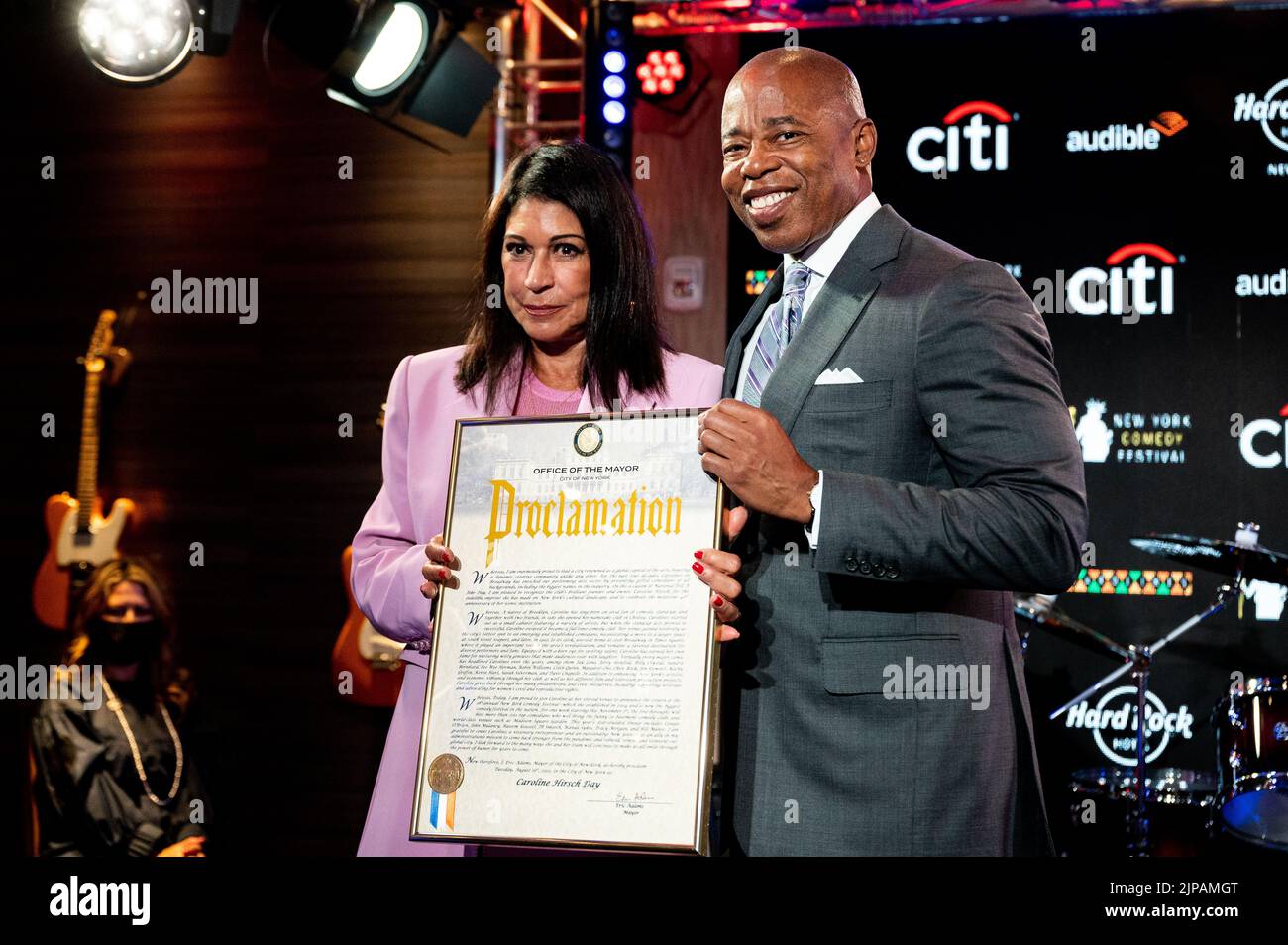New York City, United States. 16th Aug, 2022. New York City Mayor Eric Adams (D) presents Caroline Hirsch, owner of Carolines on Broadway, with a proclamation in her honor. Credit: SOPA Images Limited/Alamy Live News Stock Photo