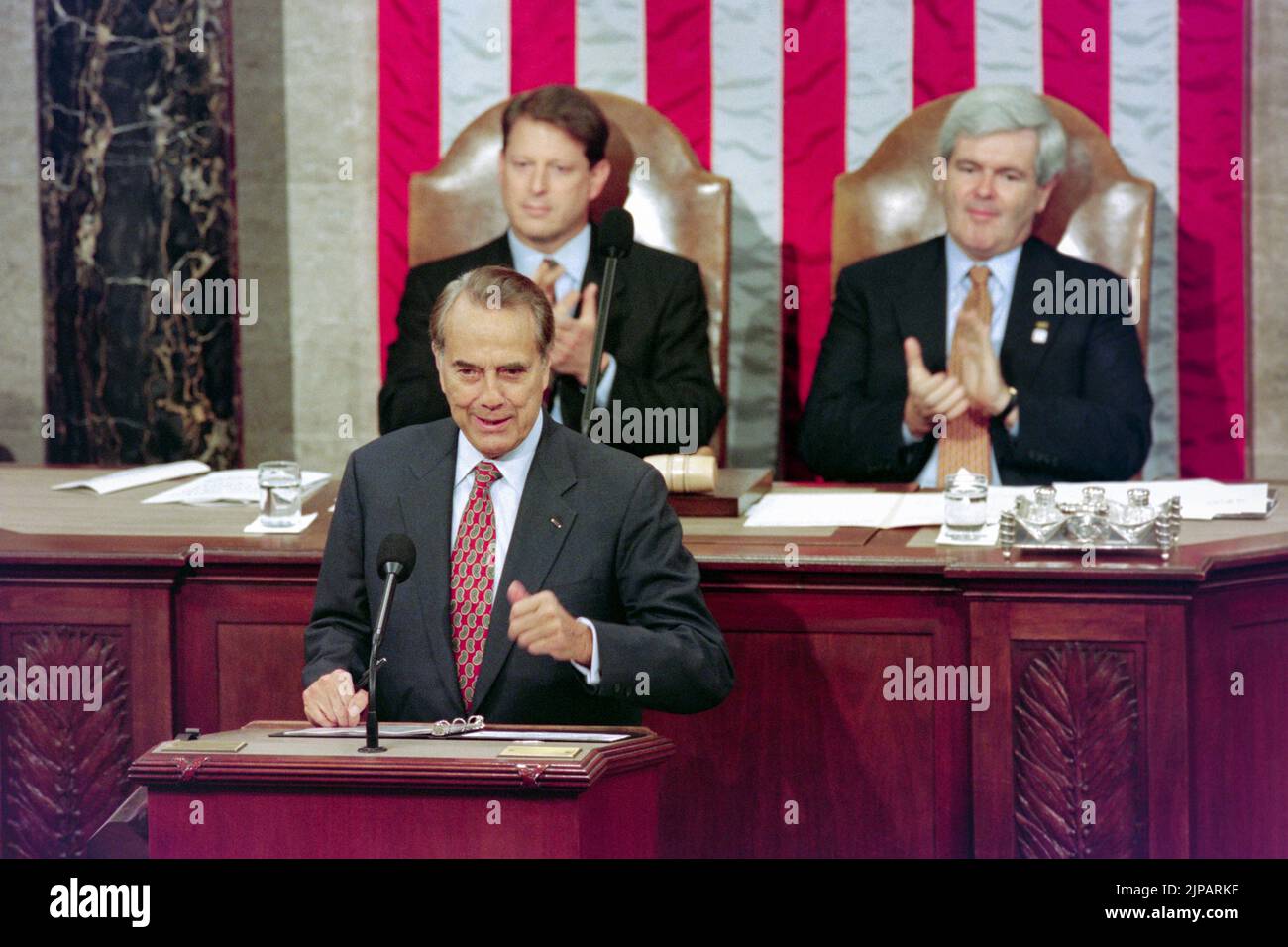 U.S. Senate Majority leader Bob Dole of Kansas, addresses a Joint Session of Congress to close the commemoration of the 50th anniversary of World War II as Vice President Al Gore and Speaker Newt Gingrich of Georgia look on at Capitol Hill, October 11, 1995 in Washington, D.C. Stock Photo