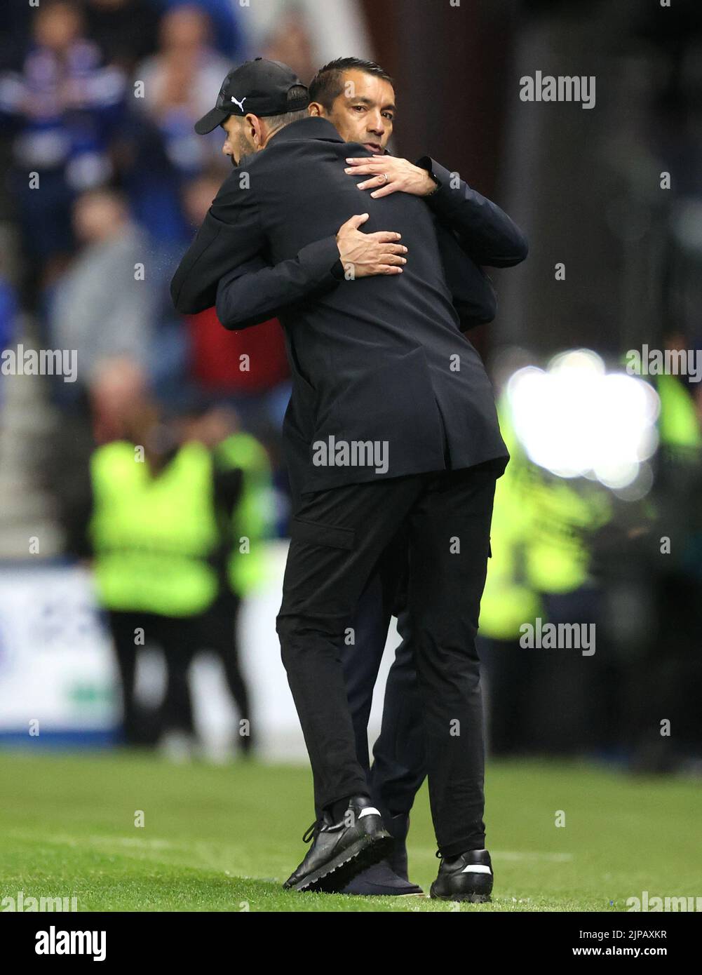 Rangers manager Giovanni van Bronckhorst greets PSV Eindhoven manager Ruud van Nistelrooy following the Champions League qualifying match at Ibrox, Glasgow. Picture date: Tuesday August 16, 2022. Stock Photo