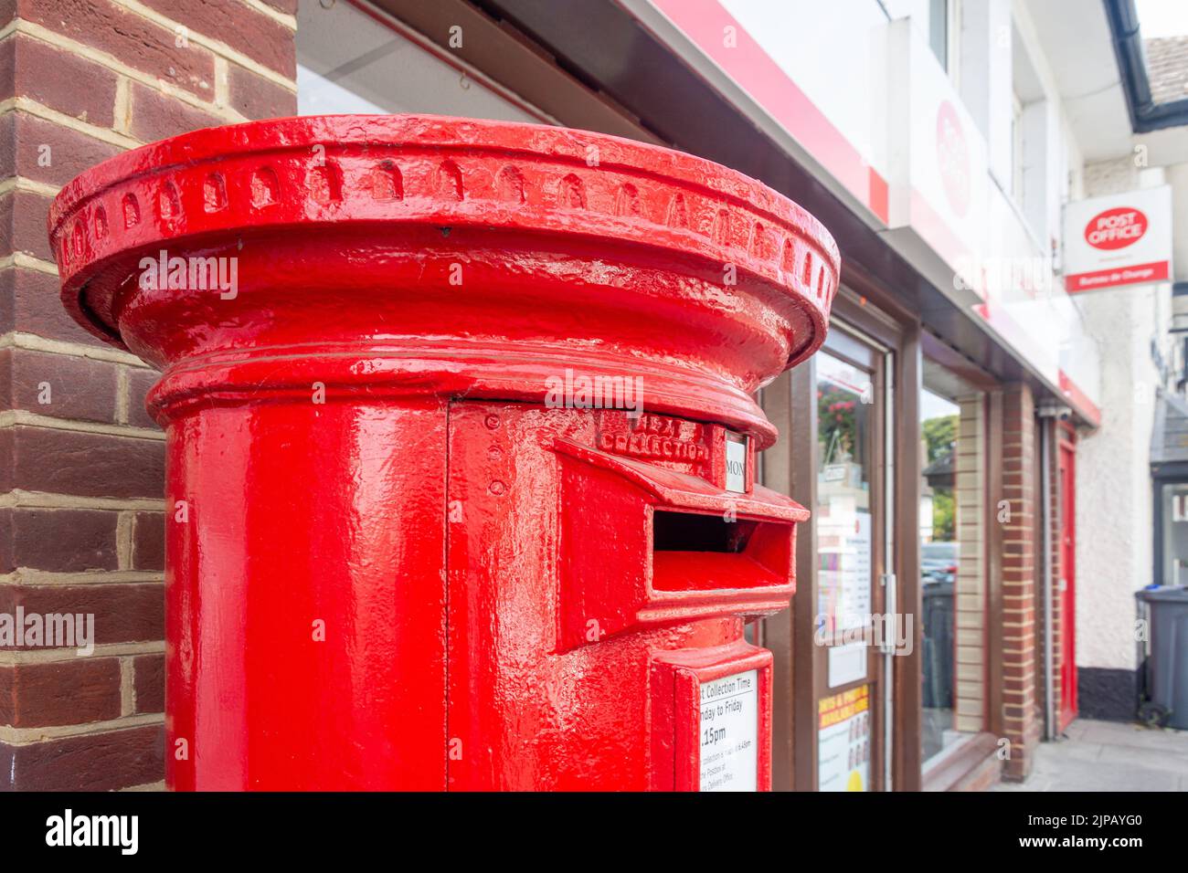 Royal Mail pillar box outside Post Office, Salisbury Street, Amesbury, Wiltshire, England