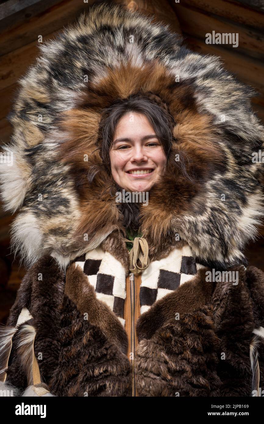 An Athabaskan Girl poses in native costume at the Chena Indian Village in Fairbanks, Alaska Stock Photo