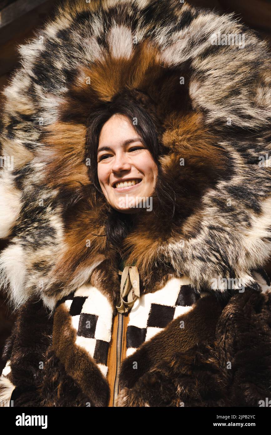 An Athabaskan Girl poses in native costume at the Chena Indian Village