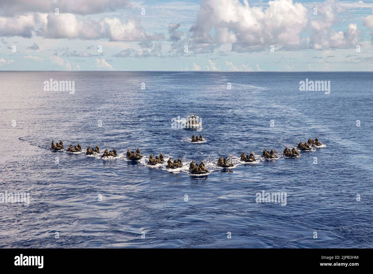 August 6, 2022 - LPD 18, Philippine Sea - U.S. Marines with Battalion Landing Team 2/5, 31st Marine Expeditionary Unit, navigate in formation during a company formation exercise off the USS New Orleans (LPD 18) in the Philippine Sea, August. 6, 2022. Blackhearts practiced formations on the water to refine infantry tactics. The 31st MEU is operating aboard the ships of the Tripoli Expeditionary Strike Group in the 7th fleet area of operations to enhance interoperability with allies and partners and serve as a ready response force to defend peace and stability in the Indo-Pacific Region. (Credi Stock Photo